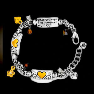 Brighton Remember Your Heart Bracelet.  Golden hearts embedded in silver.